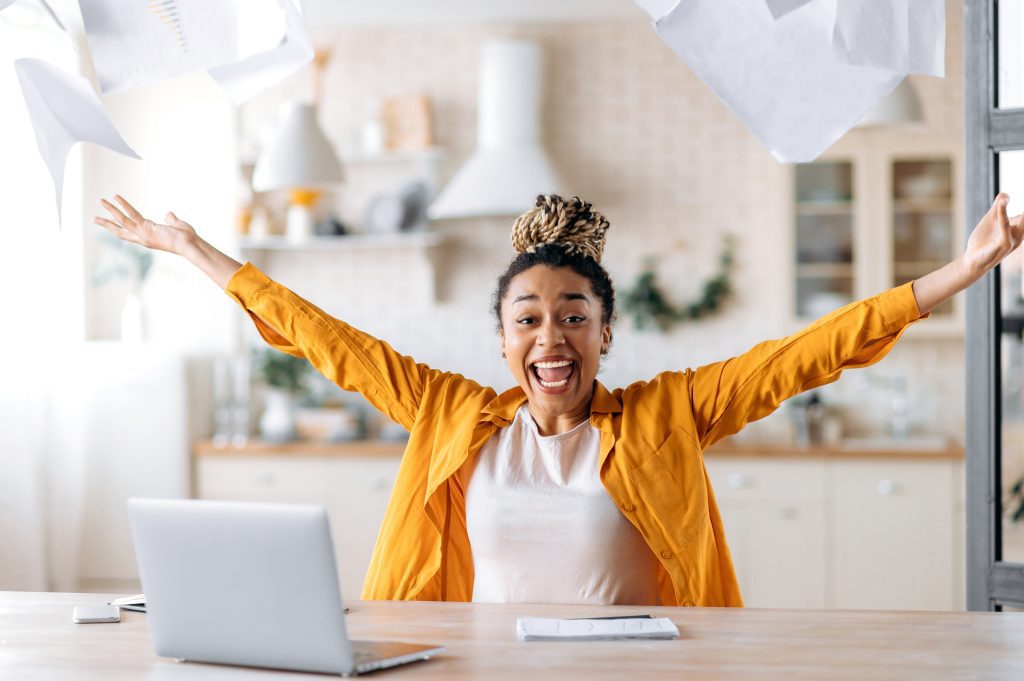 young african american woman in dreadlocks manager laptop smiling
